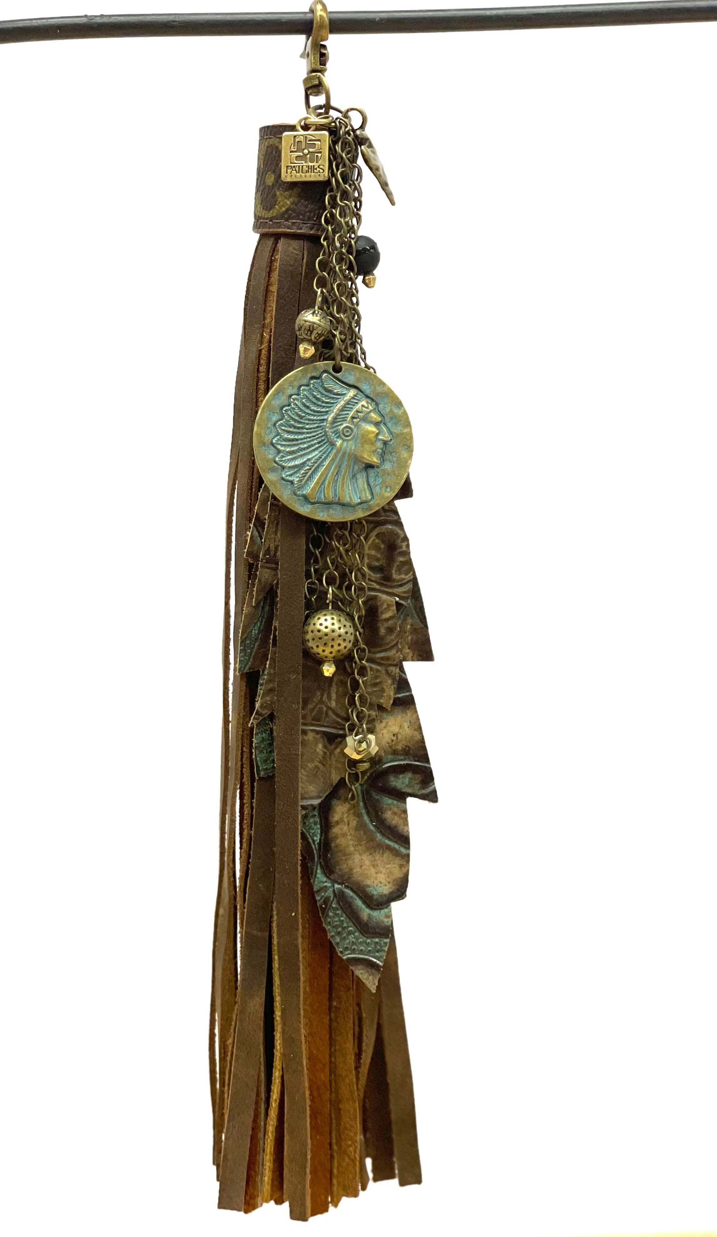 Long purse tassel -brown and turquoise embossed feathers, tarnished Indian Chief round pendant